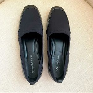 Black casual flats with patent leather detail